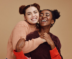Image showing Lesbian, couple hug with young women and happy with fashion and marketing, love and fun together against studio background. Lgbtq community, gen z and freedom with style and lgbt people with pride