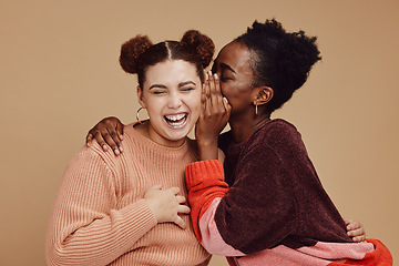 Image showing Friends, gossip and women laughing at secret joke on studio background with smile on face. Secrets, rumor and whisper in ear, black woman with happy woman discuss funny announcement for advertisement