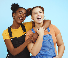 Image showing Happy young women, lesbian and couple with fashion, marketing and lgbt pride, love and fun against blue background. Lgbtq community, gen z youth laughing together and freedom with style and pride