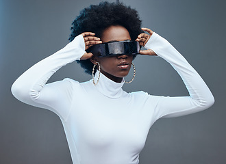 Image showing Fashion, hands and black woman with futuristic sunglasses, gen z and stylish with trendy designer brand against studio background. Young, cyberpunk and natural curly hair with beauty and edgy style