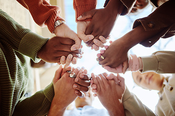 Image showing Below, students and holding hands for support, motivation or education in campus community. Diversity, friends and motivation for learning with teamwork, studying or scholarship at college together