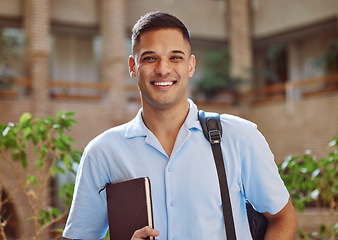 Image showing Face portrait, man and university student in campus ready for learning. Education, college and happy male learner from Brazil holding book for knowledge, studying and literature research outdoors.