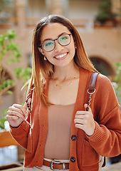 Image showing Student, woman with smile in portrait, university and education, scholarship and outdoor with learning and study. College student, academic growth and happy with glasses and geek on campus