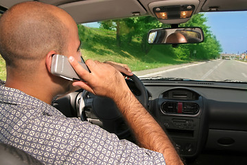 Image showing mobil phone during driving