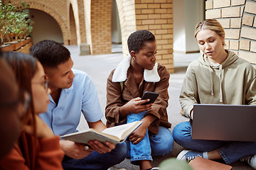 Image showing University, education and student group studying with laptop, book and phone with collaboration and discussion. Learning, scholarship and college students together talking with teamwork on campus