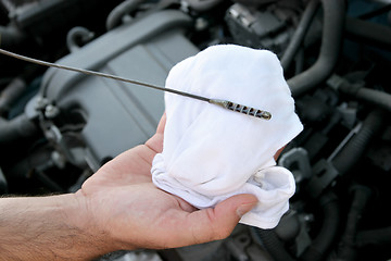 Image showing checking engine oil dipstick