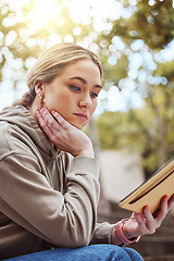 Image showing Thinking woman, notebook or reading on college campus, university park or school in education, learning or study scholarship. Student, research book or diary journal for class schedule ideas or exams