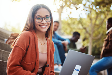 Image showing Student with laptop, woman with smile in portrait, university and education, scholarship and outdoor with learning and study. College student, online and writing paper, happy with glasses and geek