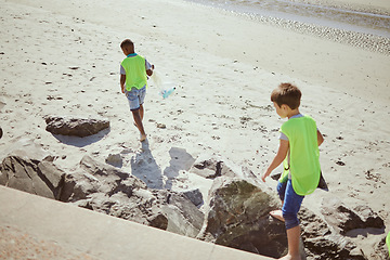 Image showing Pollution, cleaning and children with dirt on beach for clean up, environment care and eco friendly volunteer. Sustainability, recycle and kids reduce waste, pick up trash and plastic on beach sand