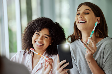 Image showing Brushing teeth, happy and friends with a phone photo of morning routine, dental cleaning and healthy together. Funny, playful and women with smile for oral care, toothbrush and mobile picture