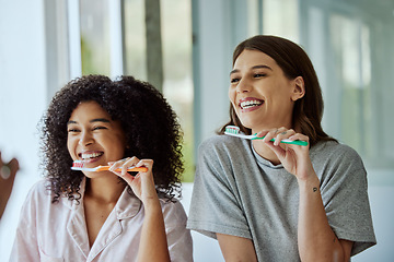 Image showing Oral care, toothbrush and female friends with a hygiene, health and wellness morning routine. Happy, smile and interracial women doing a dental treatment while brushing teeth in the bathroom.