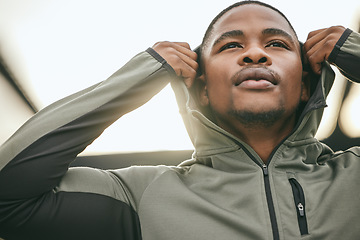 Image showing Exercise, mindset and hoodie with a sports black man getting ready for a workout, fitness or running. City, health and goal with a male athlete or runner outdoor in an urban town with motivation
