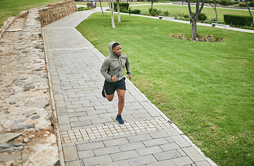 Image showing Fitness, running and black man runner outdoor in park for body workout and exercise, cardio and energy. Marathon training, run and sport motivation with wellness, healthy and active in Washington DC