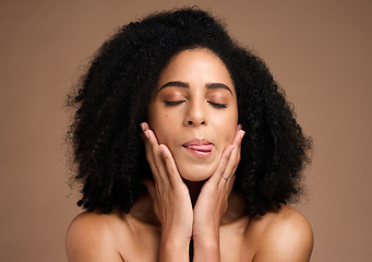 Image showing Face, skincare beauty and black woman with tongue out in studio isolated on a brown background. Makeup, cosmetics and female model with eyes closed satisfied with spa facial treatment for wellness.