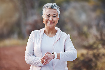 Image showing Fitness, smartwatch and portrait of a senior woman in nature for running, cardio and workout for health and wellness. Elderly female in a forest with watch app for healthy lifestyle, body and energy