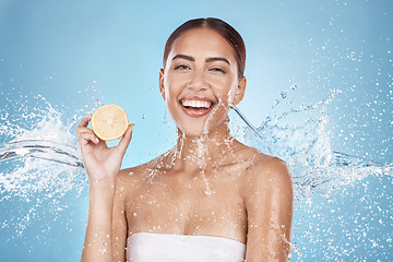 Image showing Lemon, skincare and woman in water splash for beauty, cosmetics and cleaning advertising of vegan product in studio mockup. Happy model portrait, fruit in hand and healthy glow or dermatology shine