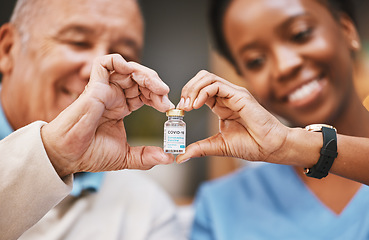 Image showing Corona virus vaccine, heart hands and people with vial in nursing home in support of medical innovation, medicine product or bottle. Covid 19 vaccination, healthcare and finger shape of patient trust