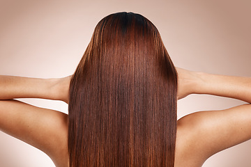 Image showing Hair, beauty and back of woman in studio for hair care, hair products and cosmetics on beige background. Salon, balayage and girl touch healthy, shine and long hair for hair salon, treatment and glow