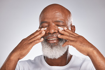 Image showing Senior black man, face and self care with facial cream with skincare, dermatology and cosmetics product. Headshot of African male with skin lotion on grey studio background for beauty spa treatment