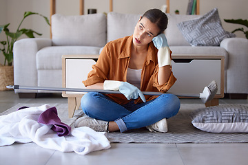 Image showing Tired, sad and woman cleaning home overwhelmed, stressed and moody thinking of tasks. Spring cleaning fatigue of young girl thoughtful in house living room with cleaner hygiene products