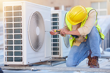 Image showing Air conditioning, technician or engineer on roof for maintenance, building or construction of fan hvac repair. Air conditioner, handyman or worker with tools working on a city development project job