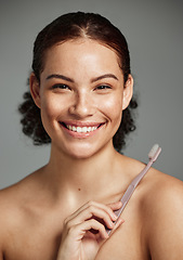 Image showing Brushing teeth, toothbrush and a woman portrait while happy about dental hygiene and teeth whitening. Face of a female with a smile for oral health, healthy mouth and self care on studio background