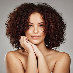 Image showing Hair care, beauty and aesthetic portrait of black woman with cosmetic afro treatment campaign. Healthy body care of hair and skincare model with natural freckles on face in gray studio.