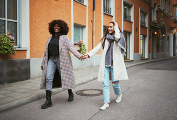 Image showing Fashion, holding hands and lesbian couple walking in street enjoying holiday, vacation and adventure on weekend. Love, lgbtq relationship and women together for happy lifestyle, freedom and relaxing