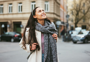 Image showing Walking, city buildings and happy woman on outdoor travel adventure in sidewalk street, road or journey In Chicago Illinois. Urban architecture, beauty and girl smile on winter vacation tour in USA