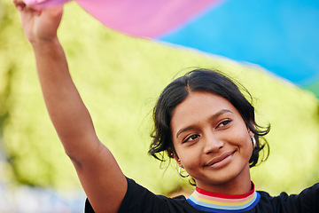 Image showing Rainbow, flag and gay pride with an indian woman in celebration of lgbt equality, inclusion or freedom. Community, support or human rights with a gender neutral or non binary female celebrating lgbtq