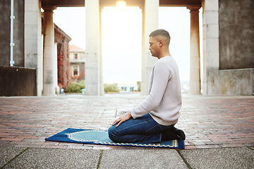 Image showing Muslim, faith and praying with an islamic man prayer to god on a carpet for eid or ramadan while fasting. Worship, holy devotion and islam with an arab male kneeling to pray for peace or trust