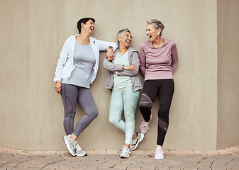 Image showing Senior women, exercise and funny with retirement, fitness and wellness, vitality and active lifestyle against wall background. Mature female friends, comedy and training, relax and sports motivation