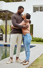 Image showing Black couple, house and swimming pool property while outdoor for a hug, love and care while happy about real estate. Man and woman at their new home with pride and smile for mortgage loan approval