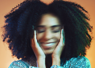 Image showing Face blur, hair care and beauty with black woman and movement with makeup and cosmetic care against studio background. Hair, cosmetics with hands and facial, wellness with afro and natural curly hair