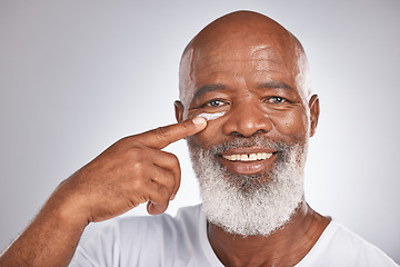 Image showing Beauty, facial cream and skincare of black man in studio for self care with lotion, dermatology and cosmetics. Face portrait of happy senior male with a product on skin for glow, health and wellness