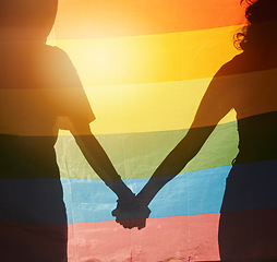 Image showing LGBT, rainbow flag and couple silhouette holding hands for gay pride, non binary support or lesbian love. LGBTQ community, overlay and queer people together in solidarity, partnership and equality