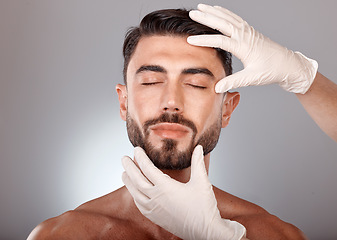 Image showing Plastic surgery, cosmetics and man with doctor hands in studio mockup for botox, aesthetic or facial dermatology for medical or beauty. Mesotherapy, hyaluronic acid or collagen of young model face