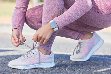 Image showing Woman, shoes lace and fitness run outdoor for cardio training workout, sports exercise and runner sneakers wellness in street. Running marathon, ready and feet zoom or sportswear shoe check in city