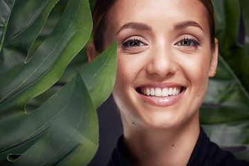 Image showing Beauty, skin and face with leaf and woman, skincare with nature aesthetic, natural cosmetics and facial portrait against studio background. Smile, glow with organic cosmetic treatment and wellness.