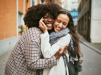 Image showing Fashion, city and friends hug in street enjoying holiday, vacation and adventure together on weekend. Friendship, travel and happy women hugging for carefree lifestyle, freedom and relaxing outdoors