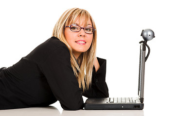 Image showing A businesswoman using laptop and webcam