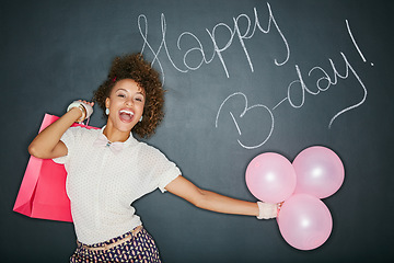 Image showing Smile, birthday balloons and portrait of a black woman with a gift and chalkboard for celebration. Happy, smile and excited person with a present and party sign with a model and happy birthday