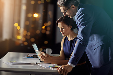 Image showing Night, business and man with woman, smartphone and typing for connection, content marketing and modern office. Employees working late, manager or coworkers with tablet, conversation or online reading