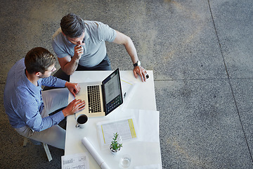 Image showing Top view, teamwork and business people with laptop in office. Planning, strategy and collaboration of male employees with computer working on sales, advertising or marketing project in workplace.