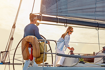 Image showing Mature couple, boat and steering wheel in sea travel, holiday investment and retirement wealth hobby. Rich, fun and sailing baby boomers or happy people on ocean or lake water for outdoor adventure