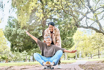 Image showing Skateboard, portrait and senior friends in park for goofy, silly and comic outdoor fun together. Funny retirement women in nature with excited and happy smile for bonding leisure in Mexico.