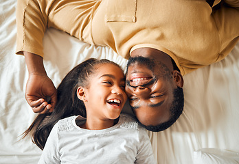 Image showing Black family, father and daughter love on a bed with a smile on face or laughing at funny memory. Above man and child together in home bedroom for bonding, support and care with safety and security