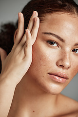 Image showing Skin, beauty and black woman portrait with skincare glow from spa treatment and makeup. Model, hand and face of a person relax after dermatology detox in a studio with gray background feeling healthy