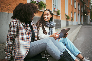 Image showing Street, friends and women talking, tablet and social media for connection, conversation and bonding outdoor. Young females, ladies and device for online reading, city and girls on road and discussion