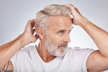 Image showing Senior man, hair care and barbershop or salon studio background for beauty, cosmetic and shampoo. Face of old person grooming to check and clean scalp for dandruff and growth with dermatology product